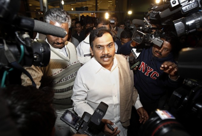 India's former telecommunications minister Andimuthu Raja (C) comes out of the airport in New Delhi December 22, 2010. Andimuthu Raja