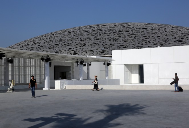 People walk at the Louvre Abu Dhabi in Abu Dhabi, United Arab Emirates, November 6, 2017. Louvre Abu Dhabi
