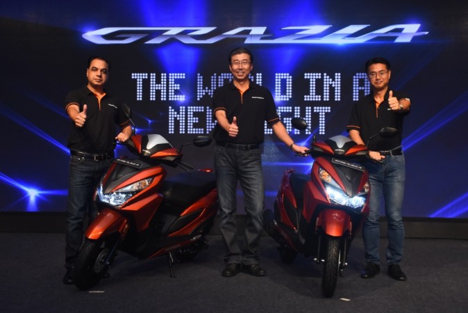 Yadvinder Singh Guleria, Minoru Kato and Atsushi Ogata during the launch of all new automatic scooter Honda Grazia Honda Grazia