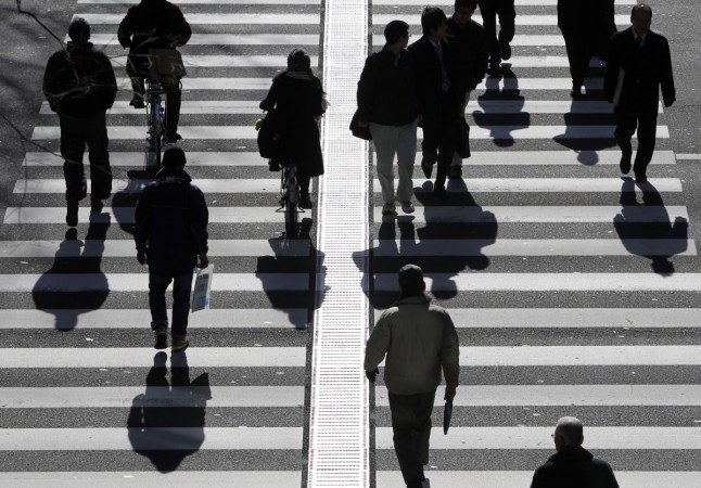 People walk on a crosswalk Employees