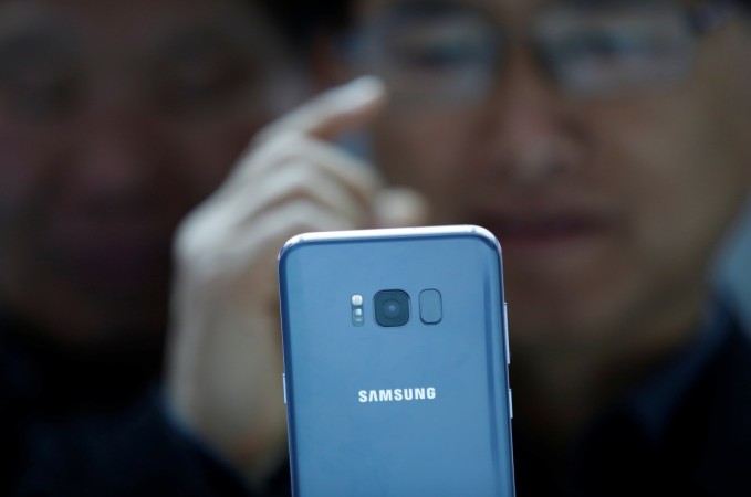A visitor looks at a Samsung Electronics' Galaxy S8 smartphone at a shop in Seoul, South Korea, April 6, 2017. Picture taken on April 6, 2017. Samsung Galaxy S8
