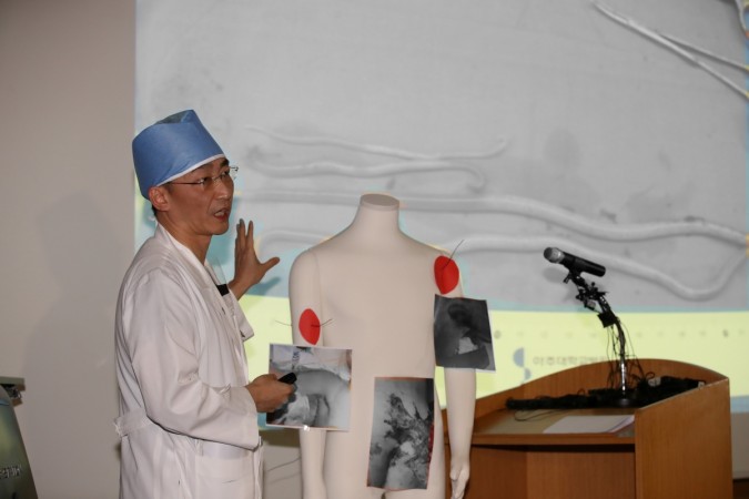 A surgeon Lee Cook-jong gives a briefing during a news conference at a hospital in Suwon, South Korea, November 15, 2017. Picture taken November 15, 2017. Worms inside North Korean defector