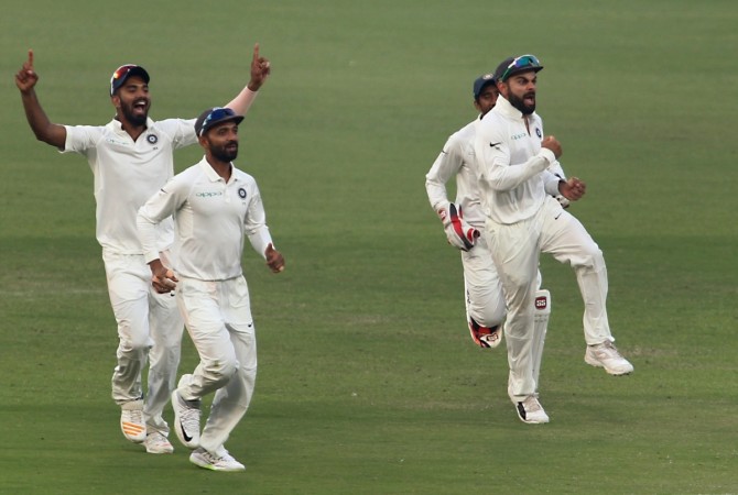 Indian players celebrate a wicket. Virat Kohli