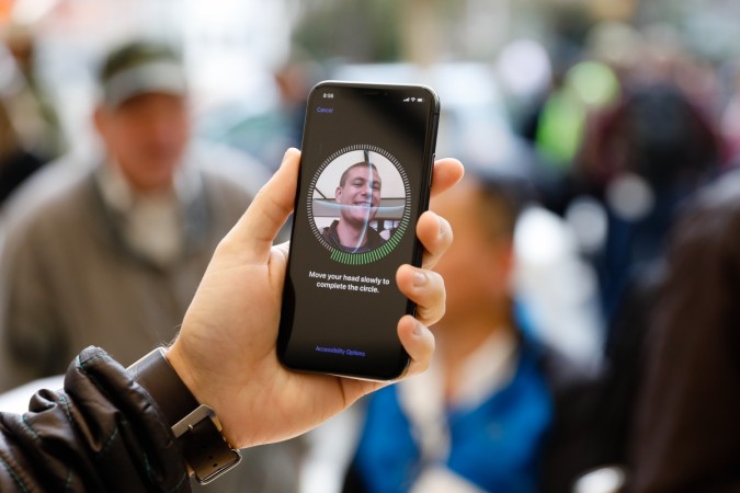 A customer sets up Face ID on his new iPhone X at the Apple Store Union Square on November 3, 2017, in San Francisco, California. Apple's flagship iPhone X hits stores around the world as the company predicts bumper sales despite the handset's eye-watering price tag, and celebrates a surge in profits. US-LIFESTYLE-APPLE
