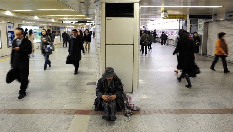 Commuters at a train station in the western Japanese metropolis of Osaka. Commuters