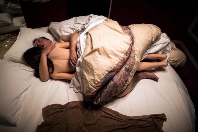 62-year-old Senji Nakajima hugs his silicone sex doll Saori while sleeping at a love hotel in Yachimata, Chiba prefecture. sex dolls