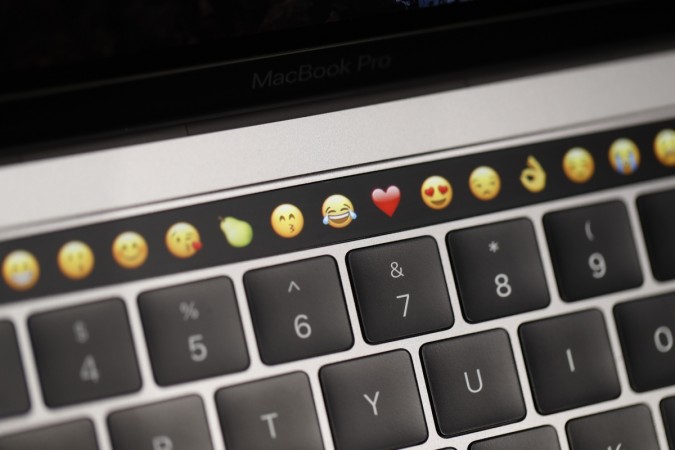 Emoticons are displayed on the Touch Bar on a new Apple MacBook Pro laptop during a product launch event on October 27, 2016, in Cupertino, California. Apple Holds Event To Announce New Products