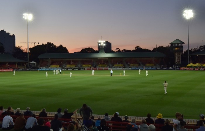 The sun sets over the North Sydney Oval during the first day of the women's Ashes cricket Test between Australia and England in Sydney on November 9, 2017. The test is also their first ever day-night game day night test