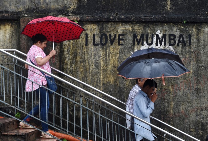 Representational Picture: Mumbai commuters walk down stairs leading from a footpath amidst rain in Mumbai on September 20, 2017. Mumbai Rains