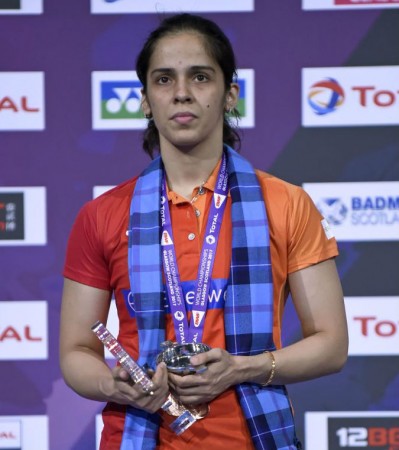 Saina Nehwal poses with her bronze medal on the podium for the women's singles during the 2017 BWF World Championships Saina Nehwal