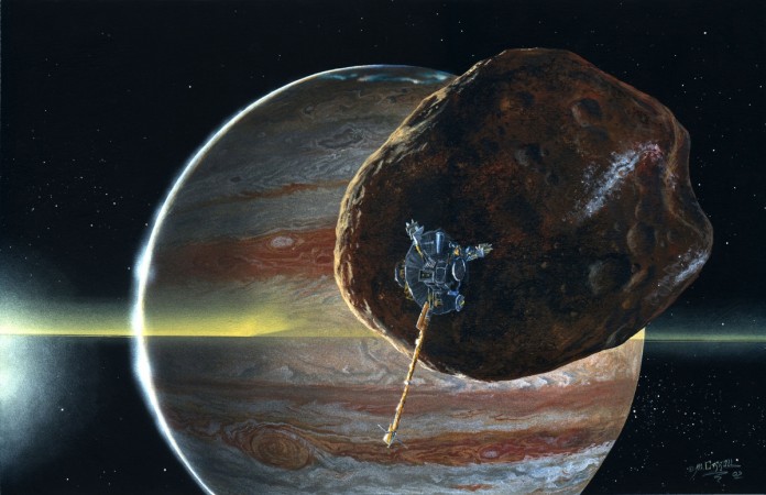 Scientists say the Jovian moon Amalthea, pictured in this undated artist's concept with the Galileo spacecraft, may be full of holes. NASA's Galileo spacecraft discovered the potato-shaped moon orbiting Jupiter and in a recent flyby found that the moon may be a collection of boulders rather then a solid body. jupiter's moon