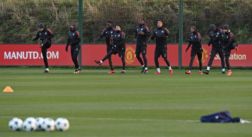 Manchester United's French striker Anthony Martial (2L), Manchester United's English midfielder Jesse Lingard (4L), Manchester United's French midfielder Paul Pogba (C), Manchester United's English defender Chris Smalling (4R), Manchester United's English midfielder Ashley Young (3R), Manchester United's Belgian striker Romelu Lukaku (2R) and Manchester United's Argentinian defender Marcos Rojo attend a team training session at the club's training complex near Carrington, west of Manchester in north west England on December 4, 2017, on the eve of their UEFA Champions League Group A football match against CSKA Moscow manchester united
