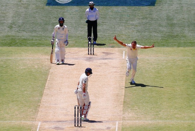 Australia paceman Josh Hazlewood (right) celebrates dismissing England captain Joe Root in 2nd Ashes Test in Adelaide on Wednesday (December 6). Josh Hazlewood