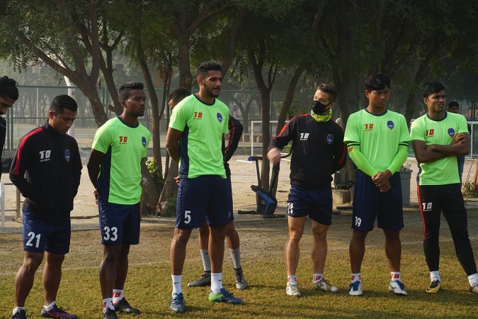 Delhi Dynamos' Spanish defender Edu Moya (kit #11) is seen wearing a mask during training delhi pollution,