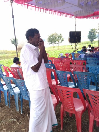 A tribe chieftain speaks on a phone during a workshop for tribal people Tribal life