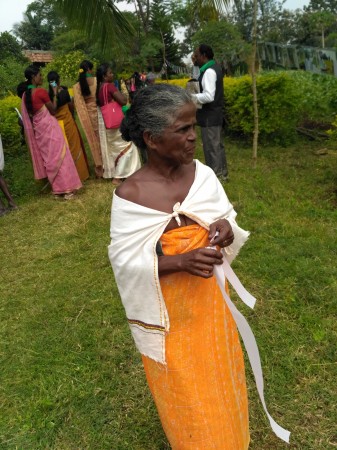 An elderly Adivasi woman is seen in the conventional attire of the tribes Tribal life