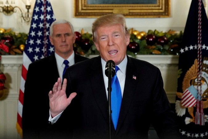 In picture: US President Donald Trump, flanked by Vice-President Mike Pence, delivers remarks recognising Jerusalem as the capital of Israel at the White House in Washington, US, on December 6, 2017. US President Donald Trump