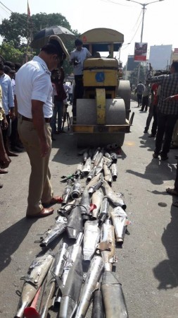 Royal Enfield exhausts seized by Bengaluru traffic police being crushed by a road roller Royal Enfield exhausts, Royal Enfield exhausts crushed