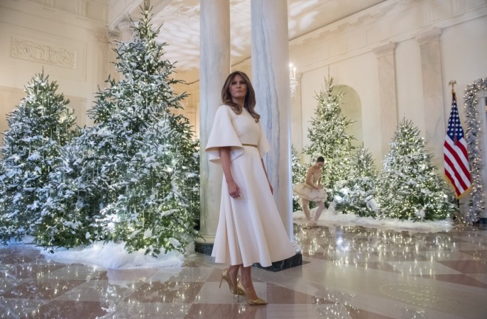 US First Lady Melania Trump stands in the Grand Foyer as she tours Christmas decorations at the White House in Washington, DC Melania Trump