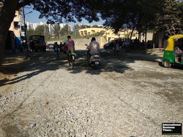 Busy Kaggadasapura road filled with construction metals Kaggadasapura road, Bangalore Potholes