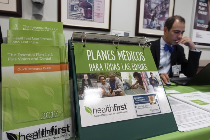 In picture: A staff member works at a health insurance counter at a hospital in New York, the United States on May 3, 2017. U.S. Republican-controlled House of Representatives on Thursday pushed through a new version of the American Health Care Act aimed to repeal and replace major parts of Obamacare, by a vote of 217-213. Obamacare