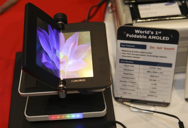 A mobile phone with a foldable AMOLED screen is displayed at an Organic Light Emitting Diode (OLED) association booth during a media preview at the 2009 International Consumer Electronics Show (CES) in Las Vegas, Nevada, January 7, 2009. Foldable smartphone display