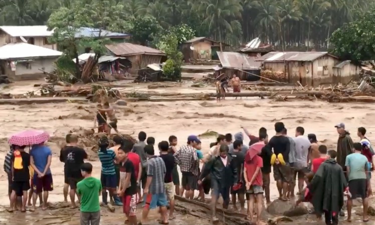 People help to rescue flood victims in Lanao Del Norte, Philippines, December 22, 2017 Philippines
