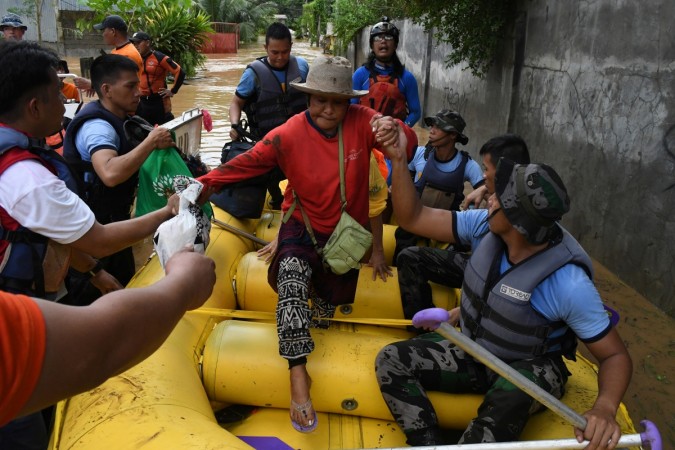 Rescuers evacuate residents during heavy flooding in Cagayan de Oro city in the Philippines Philippines