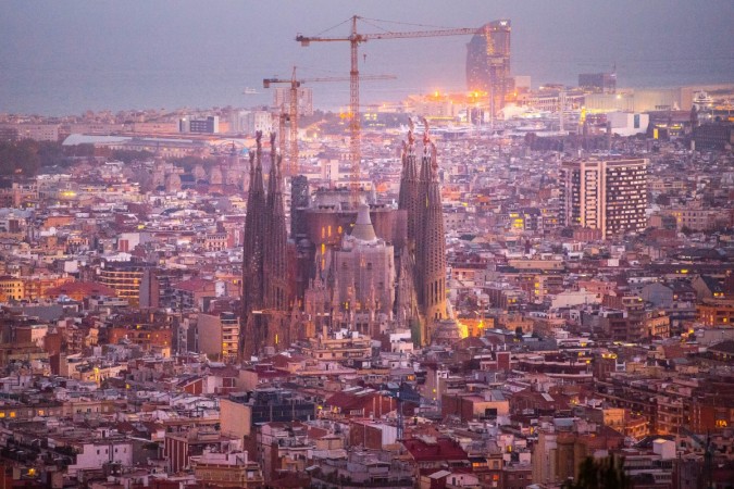 La Sagrada Familia' stands over residential buildings on October 26, 2015 in Barcelona, Spain. Barcelona