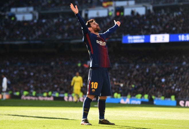 Lionel Messi of Barcelona celebrates after scoring his sides second goal during the La Liga match between Real Madrid and Barcelona at Estadio Santiago Bernabeu on December 23, 2017 in Madrid, Spain messi