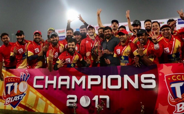 Akhil Akkineni receives CCL trophy from Chiranjeevi Akhil Akkineni receives CCL trophy from Chiranjeevi