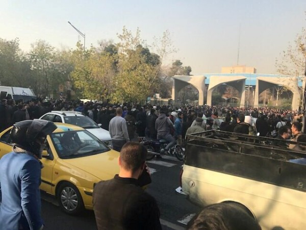 In picture: People protest near the university of Tehran, Iran December 30, 2017 in this picture obtained from social media. Iran
