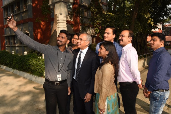 Infosys CEO Salil Parekh clicking selfie with employees at the Bengaluru campus. Salil Parekh