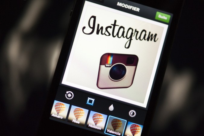 The Instagram logo is displayed on a smartphone on December 20, 2012 in Paris. Instagram backed down on December 18, 2012 from a planned policy change that appeared to clear the way for the mobile photo sharing service to sell pictures without compensation, after users cried foul. Changes to the Instagram privacy policy and terms of service set to take effect January 16 had included wording that appeared to allow people's pictures to be used by advertisers at Instagram or Facebook worldwide, royalty-free. FRANCE-US-IT-INTERNET-TELECOM-INSTAGRAM