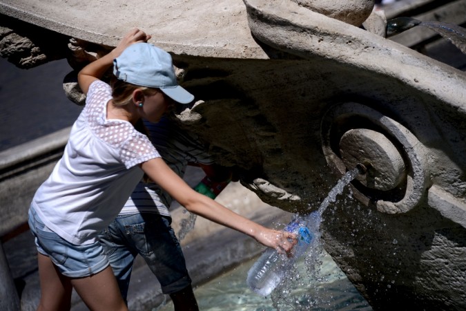 REPRESENTATIONAL PICTURE: A girl fills her bottle with water off a Barcaccia Fountain in Rome's Piazza di Spagna on July 23, 2017. Water, drinking water