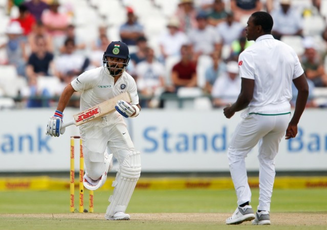 Virat Kohli and Kagiso Rabada in action Virat Kohli