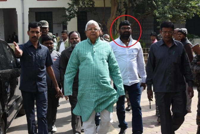 Madan Yadav (in white) accompanying Lalu Prasad Yadav, when he arrived to appear before a special CBI Court in connection with a multi-crore fodder scam case in Ranchi on Nov 14, 2017. Madan Yadav lalu yadav