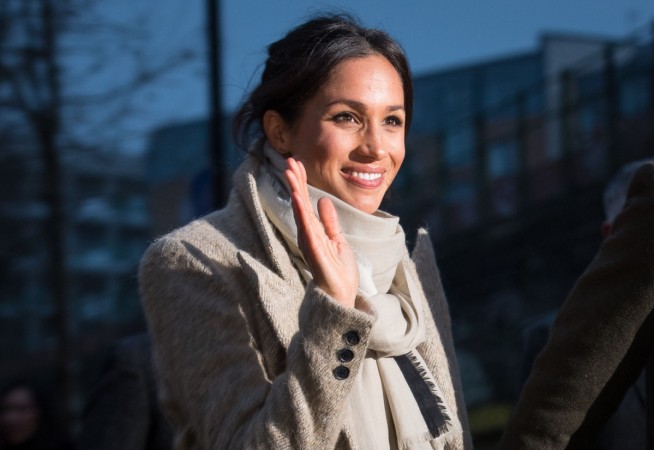 Meghan Markle waves to the crowd as she after a visit to Reprezent 107.3FM in Pop Brixton on January 9, 2018 Meghan Markle
