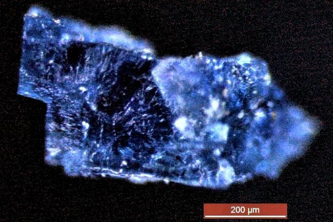 A blue crystal recovered from a meteorite that fell near Morocco in 1998. The scale bar represents 200 microns (millionths of a metre). meteorite