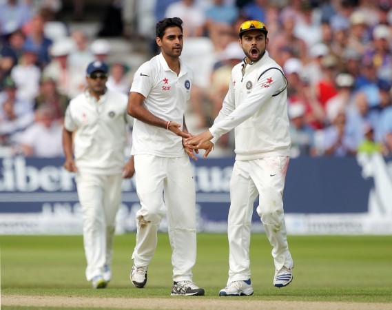 Bhuvneshwar Kumar (left) and Virat Kohli celebrate a wicket during a Test. Bhuvneshwar Kumar Virat Kohli