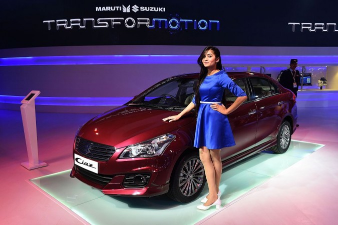 A model poses with a Maruti Suzuki Ciaz car at the Indian Auto Expo 2016 Maruti Suzuki