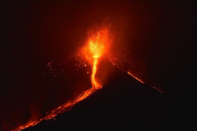Lava flows from the Mount Etna volcano on the southern Italian island of Sicily, near Catania, late on December 6, 2015. Mount Etna