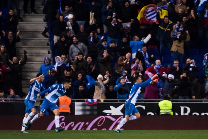 Sergio Garcia of RCD Espanyol celebrates with teammates after scoring the opening goal during the La Liga match between Espanyol and Atletico Madrid at RCDE Stadium on December 22 espanyol