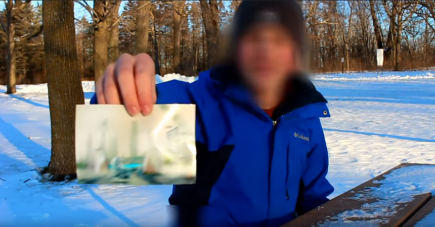 Man who claims to have time travelled from the year 6000 shows a photograph of how the world will appear in the future. time traveller
