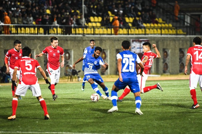 Bengaluru FC midfielder Alwyn George tries to make his way through the Transport United defense in an AFC Cup Preliminary Stage clash at the Changlimithang Stadium, in Thimphu on Tuesday. bfc