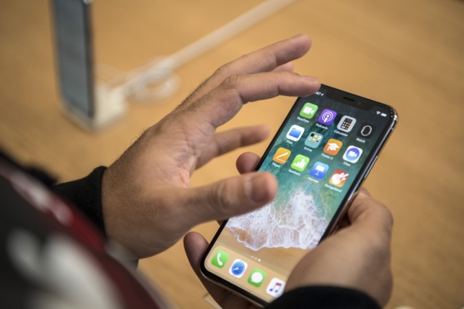 A customer views the iPhone X upon its release in the U.K on November 3, 2017 in London, England. Apple-iPhone-X