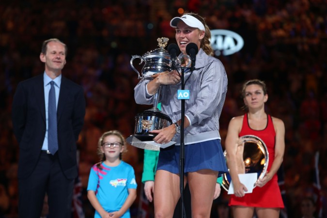 Caroline Wozniacki of Denmark receives the Daphne Akhurst Memorial Cup after winning the women's singles final against Simona Halep of Romania on day 13 of the 2018 Australian Open at Melbourne Park on January 27 wozniacki