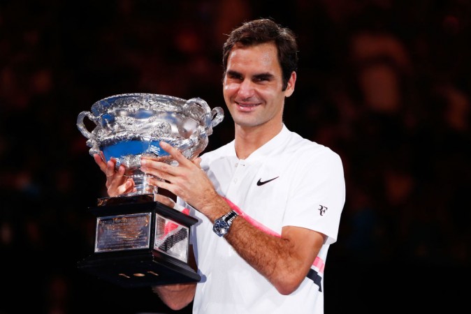 Roger Federer of Switzerland poses with the Norman Brookes Challenge Cup after winning the 2018 Australian Open Men's Singles Final against Marin Cilic of Croatia on January 28, 2018 in Melbourne, Australia. Roger Federer