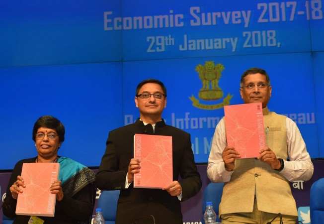 In picture: Chief Economic Advisor Arvind Subramanian (right) shows the pink Economic Survey 2017-18, in New Delhi on January 29, 2018. Chief Economic Adviser Arvind Subramanian