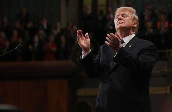 U.S. President Donald Trump applauds during his first State of the Union address Donald Trump